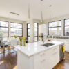 Interior shot of a modern house kitchen with large windows