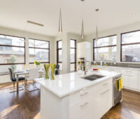 Interior shot of a modern house kitchen with large windows