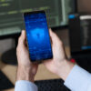 man holding smartphone with lock