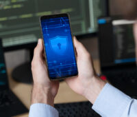 man holding smartphone with lock