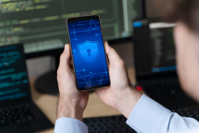 man holding smartphone with lock