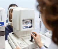 Doctor checking image with the help of machine