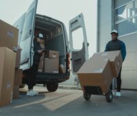 A Man and a Woman Working for a Delivery Company
