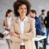 young smiling mixed race businesswoman standing in boardroom