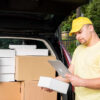 Delivery man holding tablet