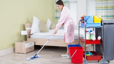 housekeeper is cleaning the house