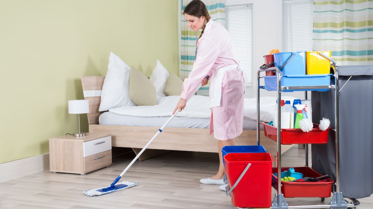 housekeeper is cleaning the house