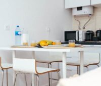 Kitchen with a microwave and water heater