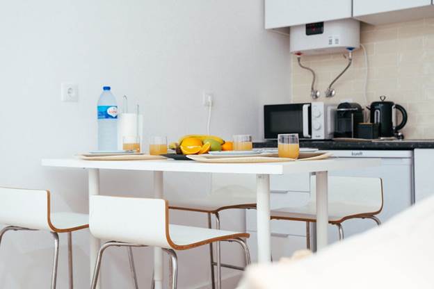 Kitchen with a microwave and water heater