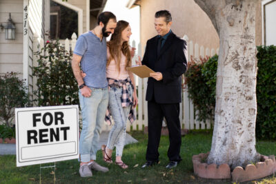 Couple signing papers for new house