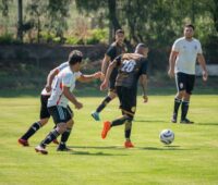 Men Playing Football on Field