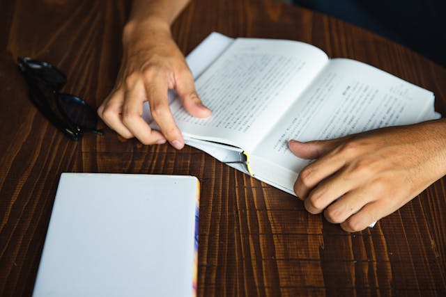 man enjoying reading book
