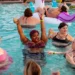 Plus-size women having fun in the swimming pool