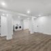 an empty room with a washer and dryer