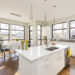 Interior shot of a modern house kitchen with large windows