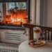 Coffee with Cream on Furniture Against Fireplace