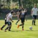 Men Playing Football on Field