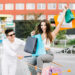 Man driving shopping cart with happy woman